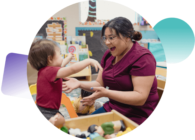 Child care educator Rebecca Reyes plays with an infant in a child care center.