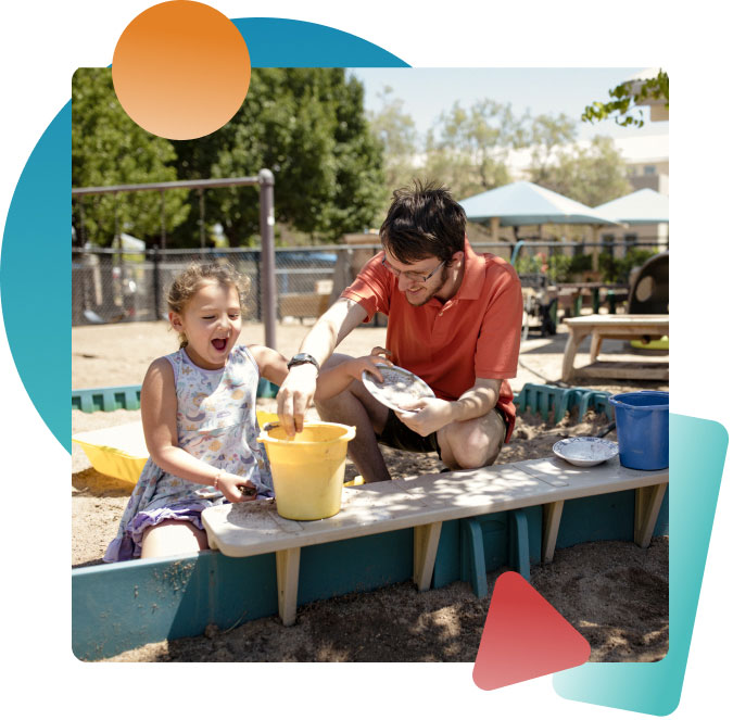 Early childhood educator Alex Miller plays outdoors in a sandbox with his students